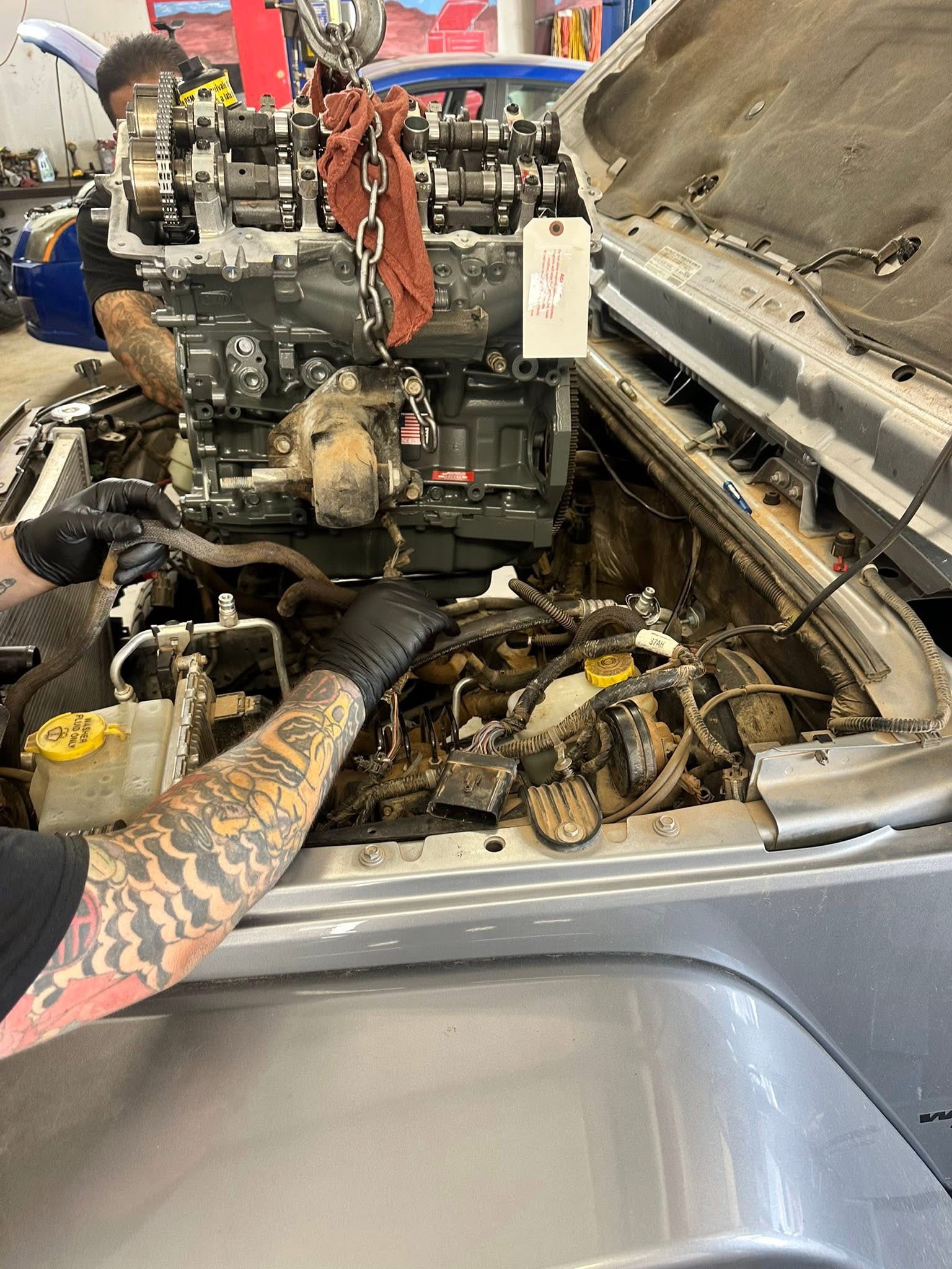 Technician working on an engine repair