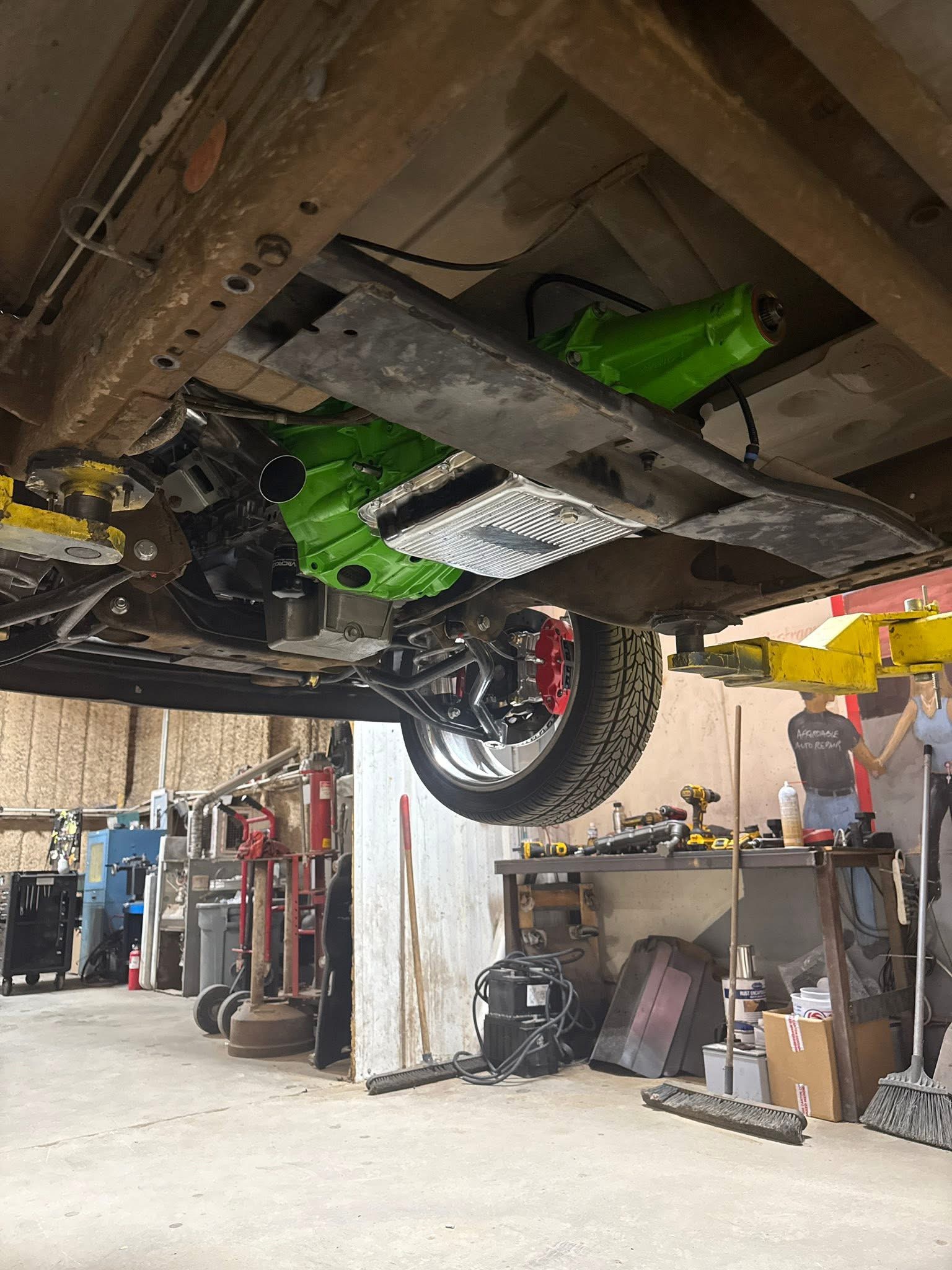 Vehicle raised for undercarriage repair